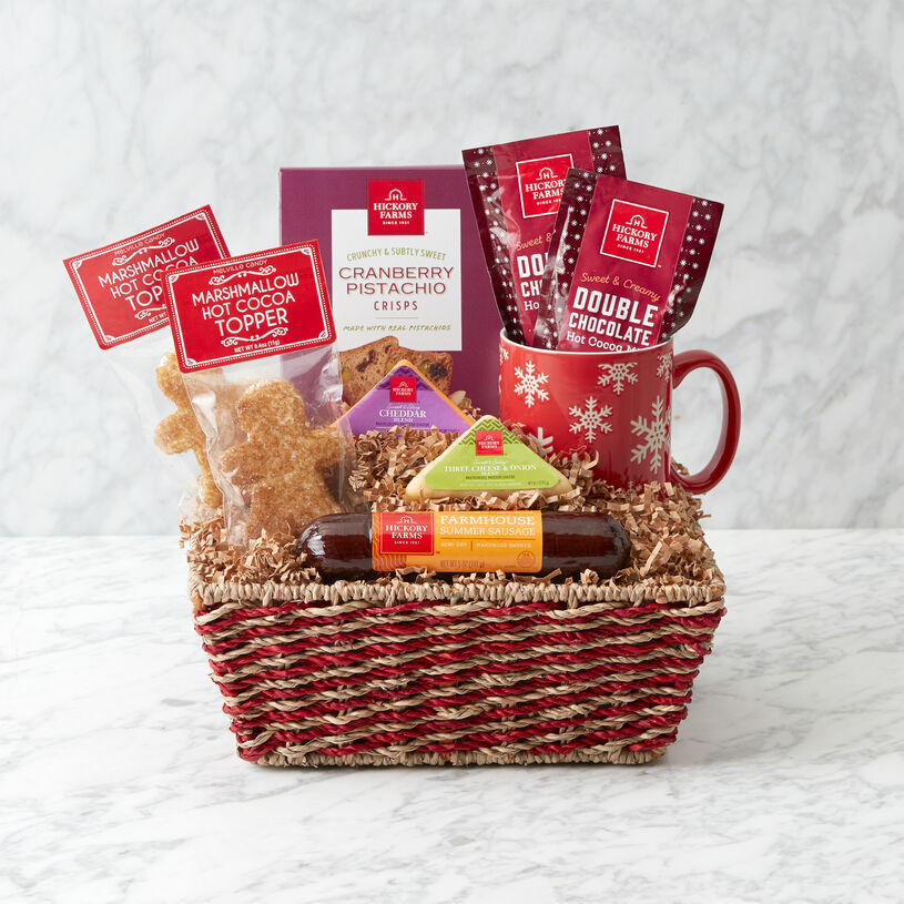 Summer Sausage, two cheeses, Cranberry Pistachio Crisps, Hot Cocoa, Gingerbread Men Marshmallow Hot Cocoa Toppers, and a festive Snowflake Mug.