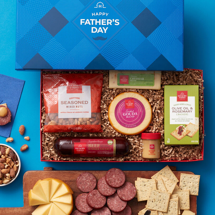 Father's Day box filled with Signature Beef Summer Sausage, Jalapeño Cheddar Blend, and Smoked Gouda Blend cheeses, Sweet Hot Mustard, Olive Oil & Rosemary Crackers, and Everything Seasoned Mixed Nuts.