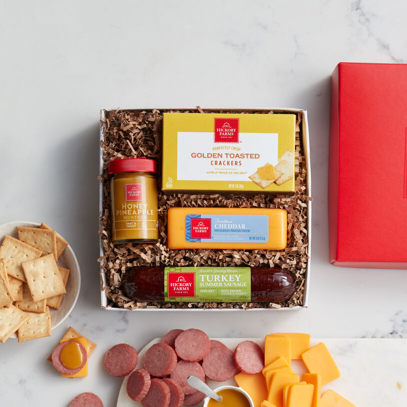 Hickory Farms Sweet & Smoky Turkey Sampler includes turkey summer sausage, mustard, cheese, and crackers