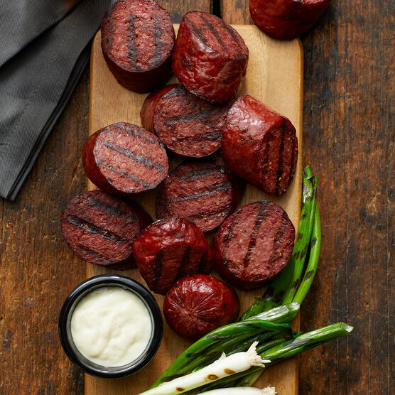 Alternate view of Hickory Farms horseradish sauce shown with grilled, top-rated beef summer sausage