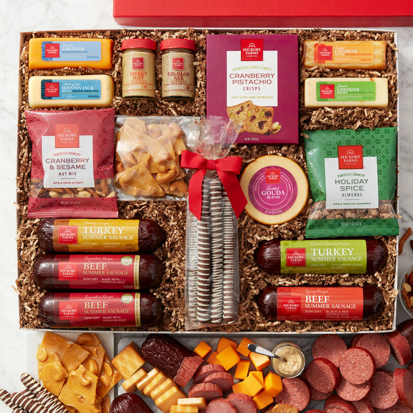 Two Signature Beef Summer Sausages, Spicy Beef, Sweet & Smoky Turkey, and Savory Turkey Summer Sausages, five gourmet cheeses, two of our famous mustards, and Cranberry Pistachio Crisps and nuts.