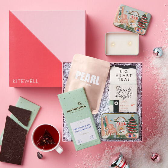 This gift box is filled with a brightening face mask, Tea, and a Paddywax candle, and a Dark Chocolate Cocoa Nib Mint bar.