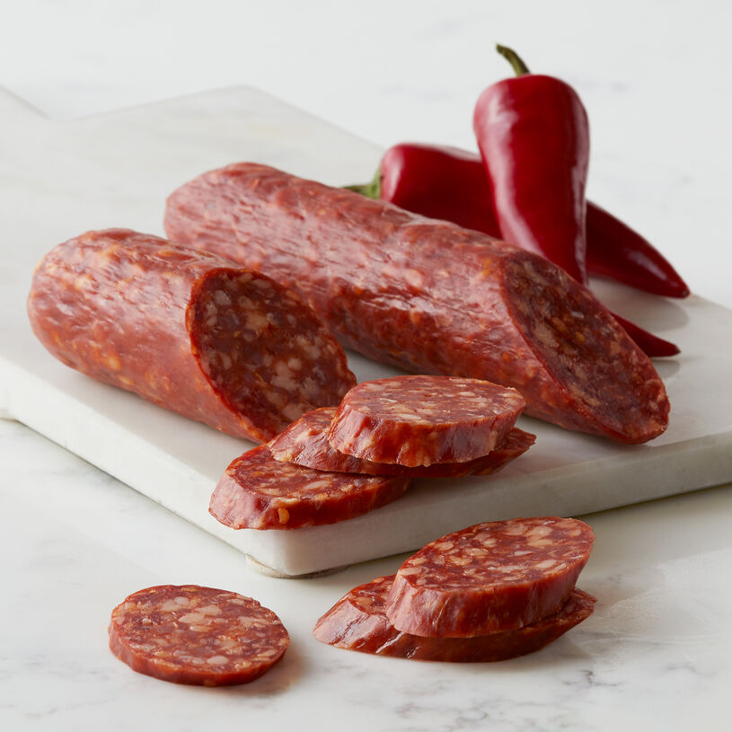 Our Three Pepper Dry Salami is made with spicy white, cayenne, and crushed red peppers, before being cured by a master Salumiere for a full-bodied flavor that builds in heat with each wonderful bite.