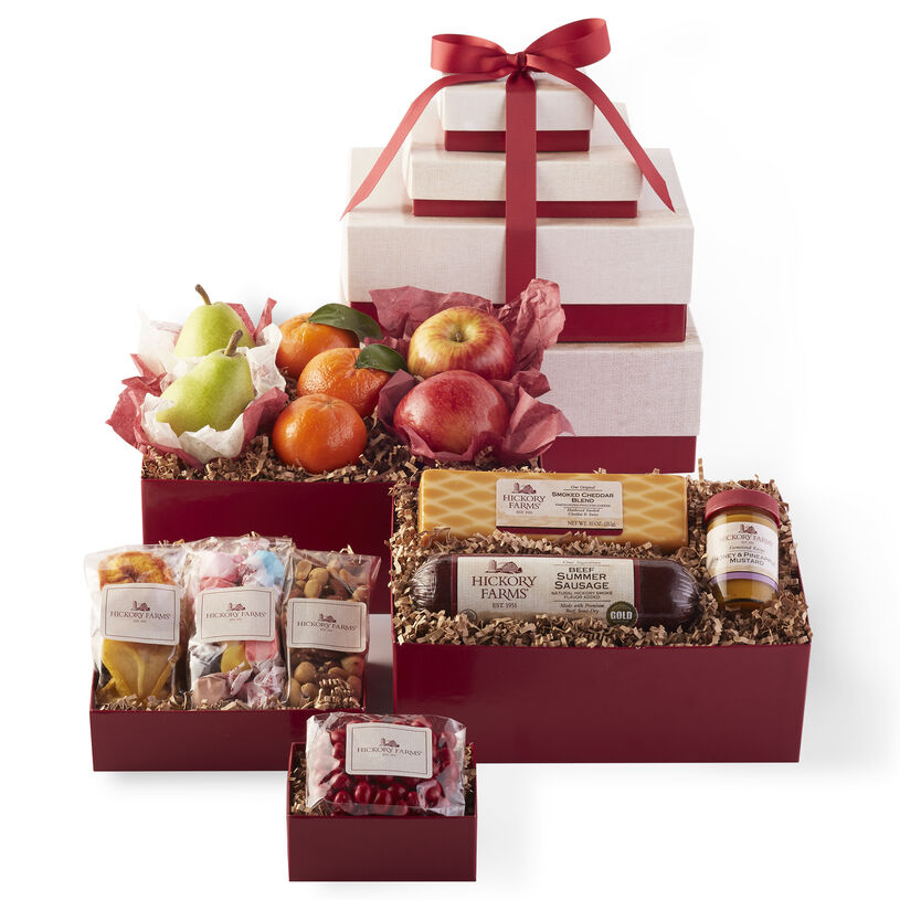 Happy Birthday Tower includes fruit, summer sausage, cheese, mustard, mixed nuts, dried fruit, taffy, and Boston baked beans