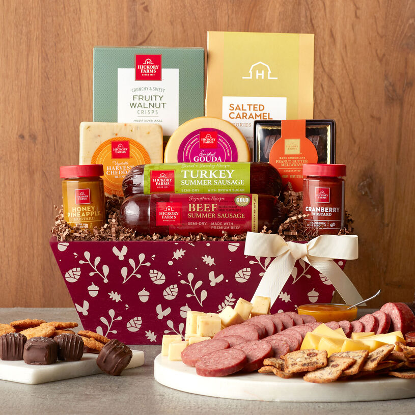 This fall gift basket is filled with savory meat and cheese, mustards, crisps, Spiced Pumpkin Cookies, and Belgian-Style Chocolate Truffles.