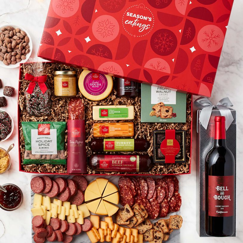 Give the gift of the holiday party, complete with wine! This premium meat and cheese gift box lets them create savory flavor combinations