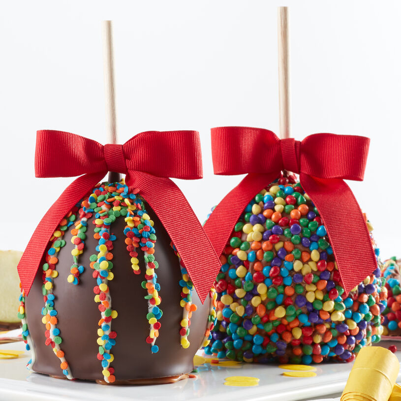 Caramel apples with birthday frosting and confetti sprinkles 