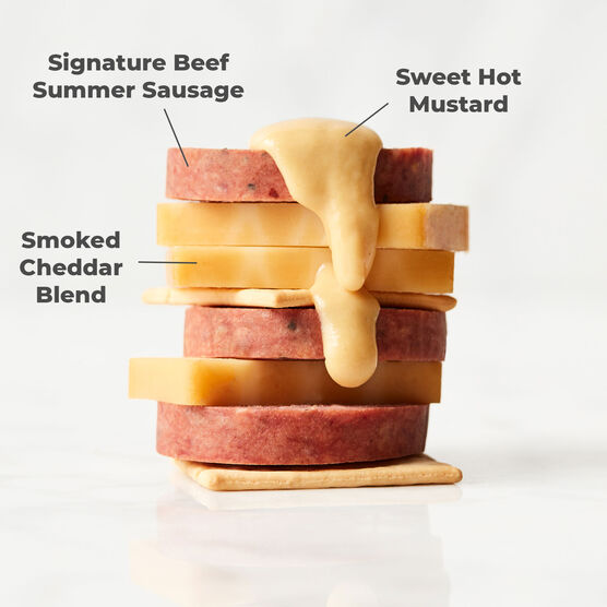 Alternate view of Hickory Farms smoked cheddar cheese stacked with top rated summer sausage, farmhouse cheddar cheese, and sweet hot mustard
