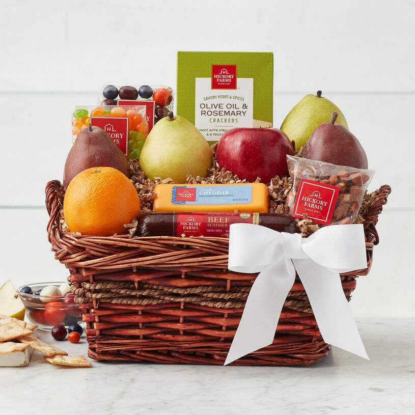 This gift basket includes luscious fresh fruits, savory cheese and mixed nuts along with a festive baseball cookie