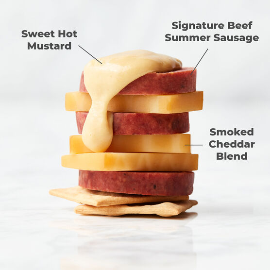 Alternate view of Hickory Farms top rated summer sausage stacked with smoked cheddar, farmhouse cheddar cheese, and sweet hot mustard