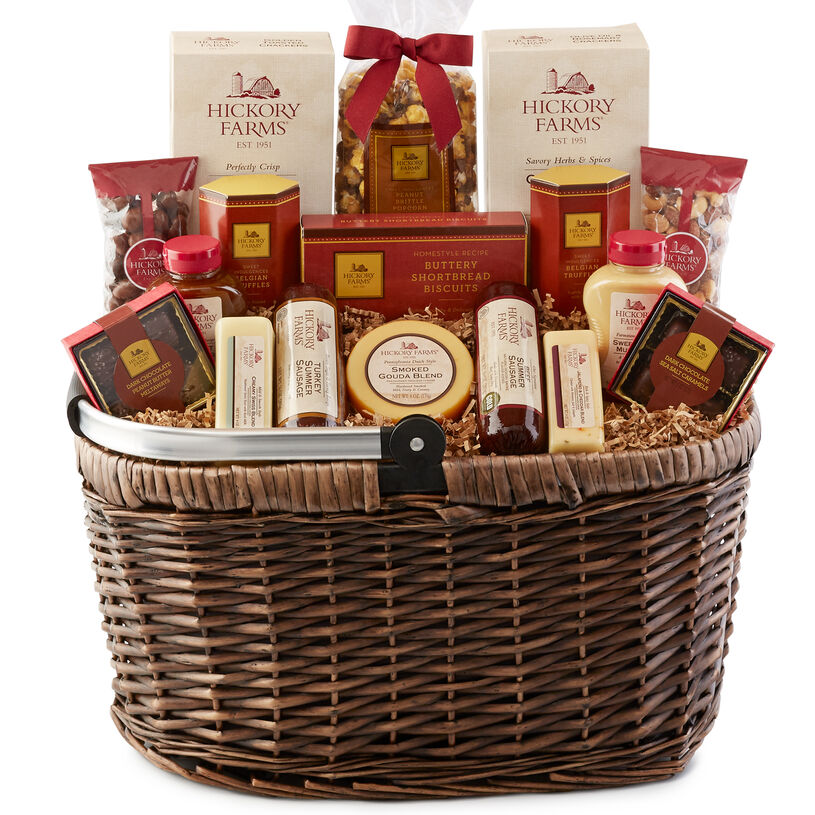 Hickory Farms Picnic Basket includes sausage, cheese, mustard, crackers, nuts, and biscuits