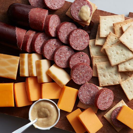 Alternate view of gift box that includes crackers, mustard, summer sausage, and cheeses