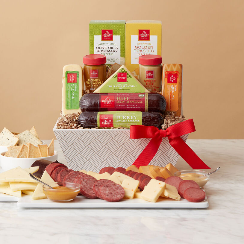This basket includes Beef and Sweet & Smoky Turkey Summer Sausages, Smoked Cheddar Blend, Three Cheese & Onion Blend, Creamy Swiss Blend, mustards, and crackers