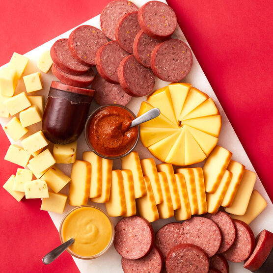Spicy Summer Sausage & Cheese Gift Box meat & cheese sliced and arranged on board