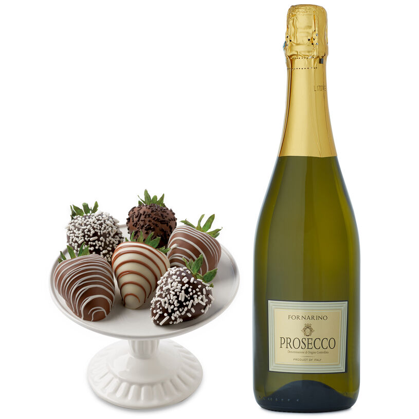 This gift box has strawberries dipped in dark, milk, and white chocolate, and a bottle of La Fornarina Prosecco.