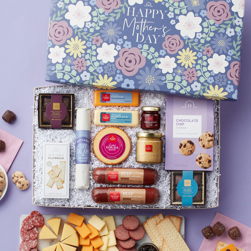 Mother's Day Charcuterie gift filled with  All-Natural Beef Summer Sausage, Dry Salami, Gouda, Mission Jack, Cheddar, Strawberry Fig Jam, Champagne Dill Mustard, Sea Salt Flatbread, chocolates, and cookies.