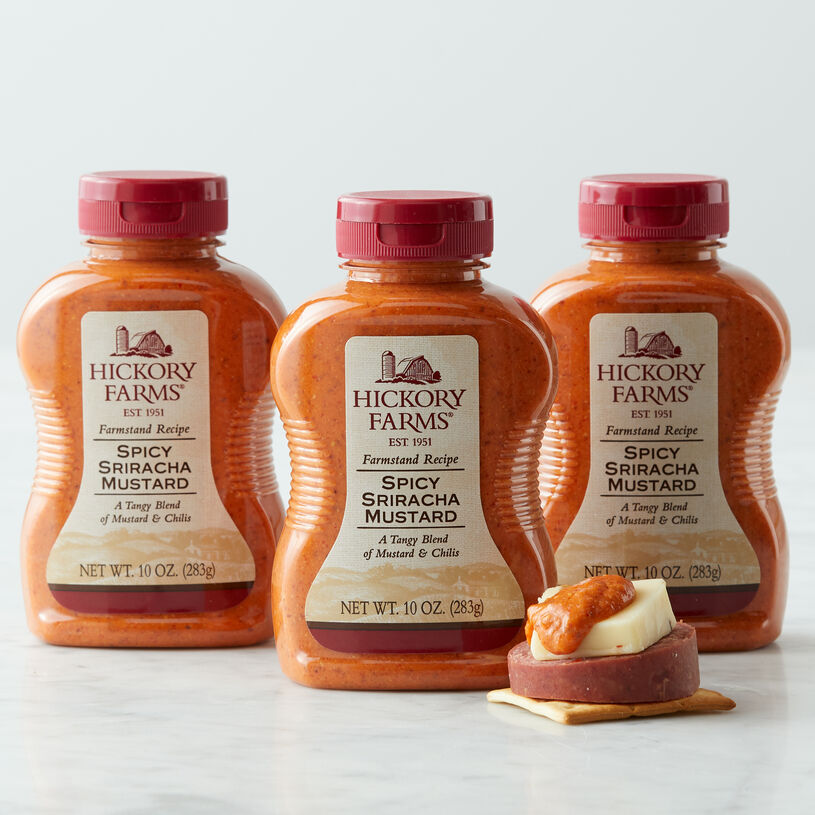 ur Spicy Sriracha Mustard is an expertly crafted blend of tangy mustard and spicy, smoky chilis that’s perfect for pairing with your favorite cheeses and sausage.