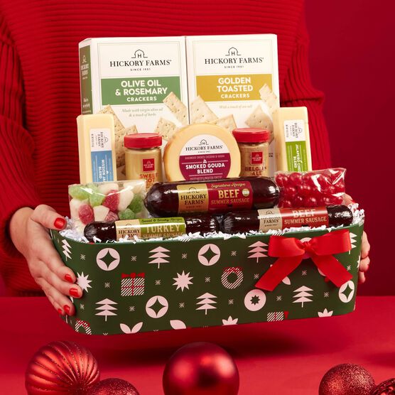 Deck The Halls Holiday Gift Basket being held by hands