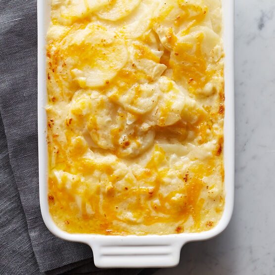 Alternate View of This hearty side dish is crafted from sliced Russet potatoes, cheddar, Gruyere, and Parmesan cheeses, and heavy cream