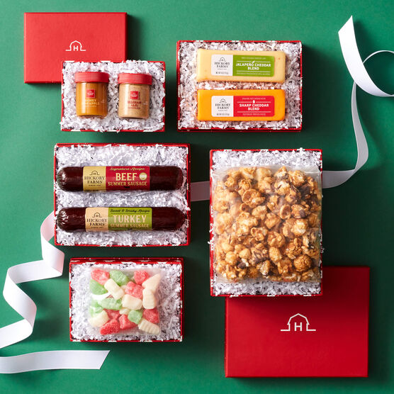Holiday Sweet and Savory Gift Tower boxes opened showing components on green background