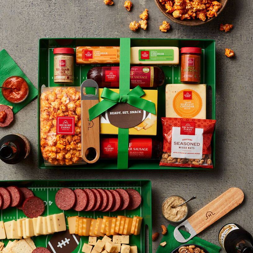 This gift set features a reusable serving tray in a fun football print paired with HIckory Farms favorites for a crowd-pleasing snack spread.