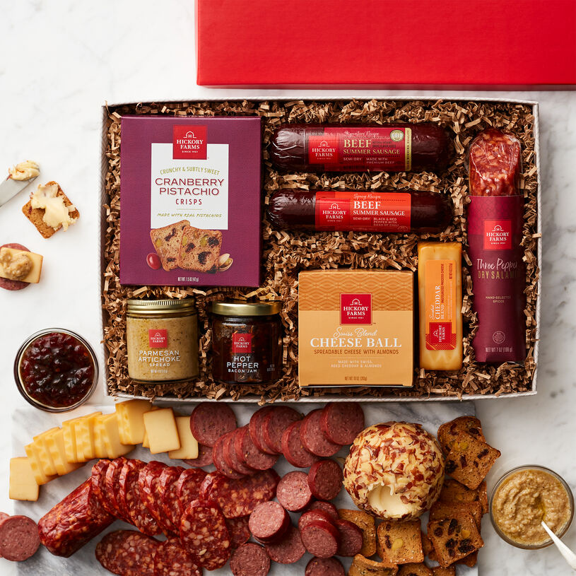 Includes summer sausage, salami, Swiss Blend Cheese Ball, Smoked Cheddar Blend, Artichoke Parmesan Spread, Hot Pepper Bacon Jam, and Cranberry Pistachio Crisps