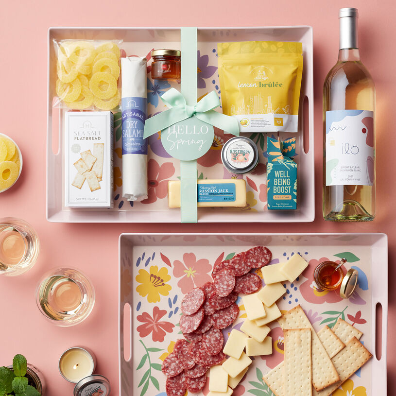 This gift set features spring-themed touches and everything needed to create a delicious meat and cheese spread.