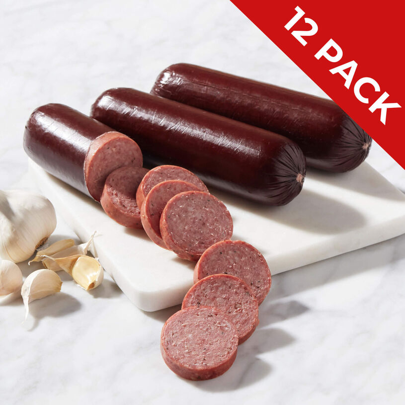 12 pack of farmhouse summer sausage sliced on a marble cutting board