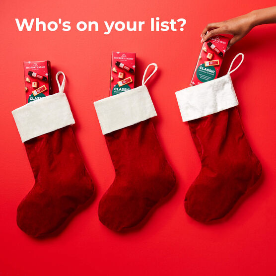 Classic Meat and Cheese Stocking Stuffer components, summer sausage, mustard, and cheese in stocking