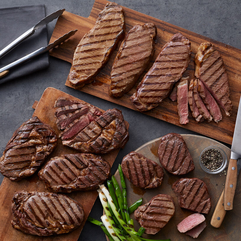 The Deluxe Assortment includes filets, New York strip steaks, and boneless ribeye steaks