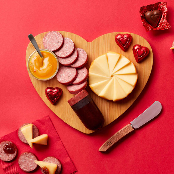Valentine's Day Charcuterie Board Gift Set meat and cheese sliced on heart-shaped board