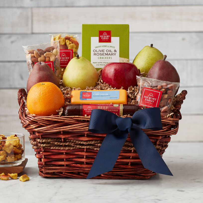 This Father's Day gift basket is filled with snacks Dad will love to dig into! Summer sausage, cheese, fresh fruit, nuts, and crackers all pair deliciously and let him create his favorite flavor combinations.