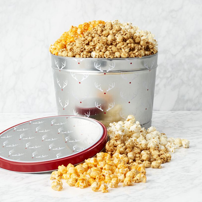 A delectable sampling of Sweet & Salty Kettle Corn, Premium Caramel Corn, and Cheddar Cheese Popcorn, Holiday Popcorn Tins, Christmas Popcorn Tins