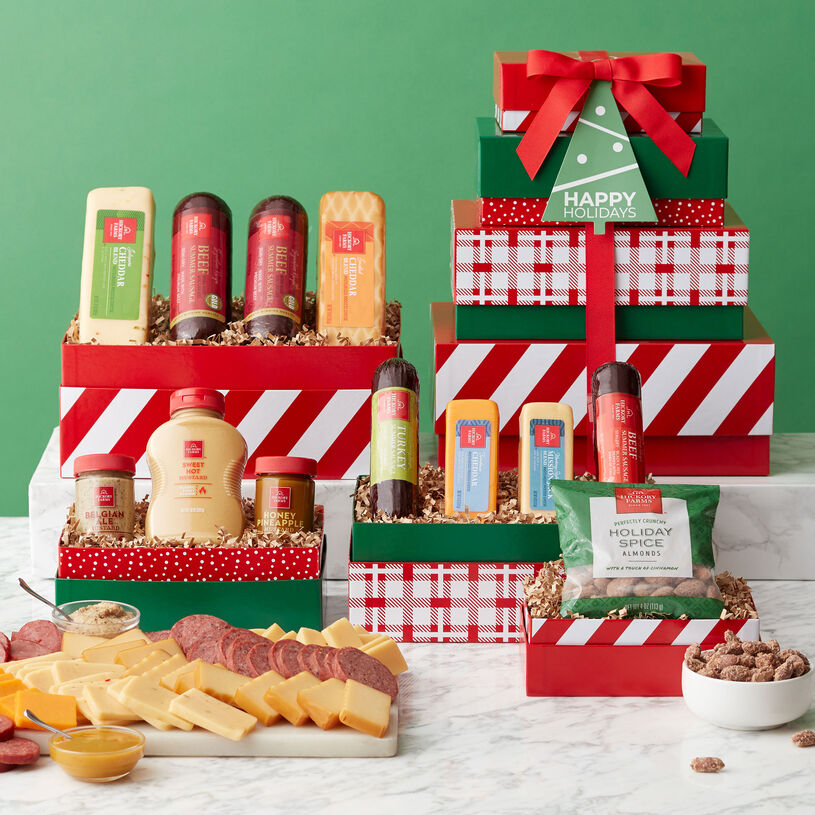 This holiday tower includes Signature Beef Summer Sausage, Turkey and Spicy Summer Sausages, Horseradish Cheese, and Farmhouse Cheddar, and spreadable cheese.