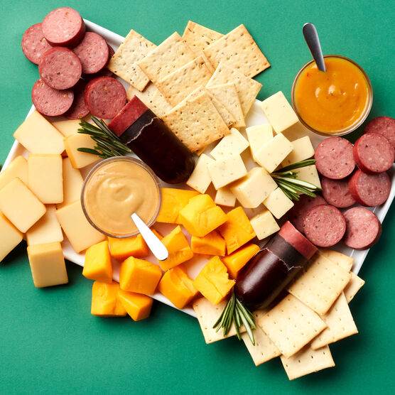 Holiday Signature Flavors Gift Basket meat and cheese sliced and arranged on board