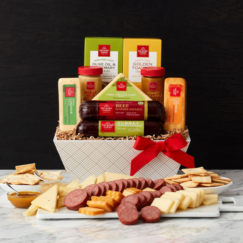 This basket includes Beef and Sweet & Smoky Turkey Summer Sausages, Smoked Cheddar Blend, Three Cheese & Onion Blend, Creamy Swiss Blend, mustards, and crackers