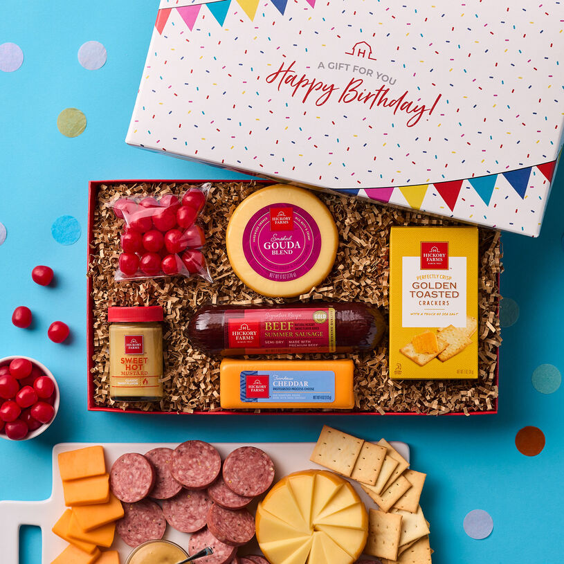 Best Birthday Wishes Gift Box includes beef summer sausage, gouda and cheddar cheese, sweet hot mustard, golden crackers, and chocolates