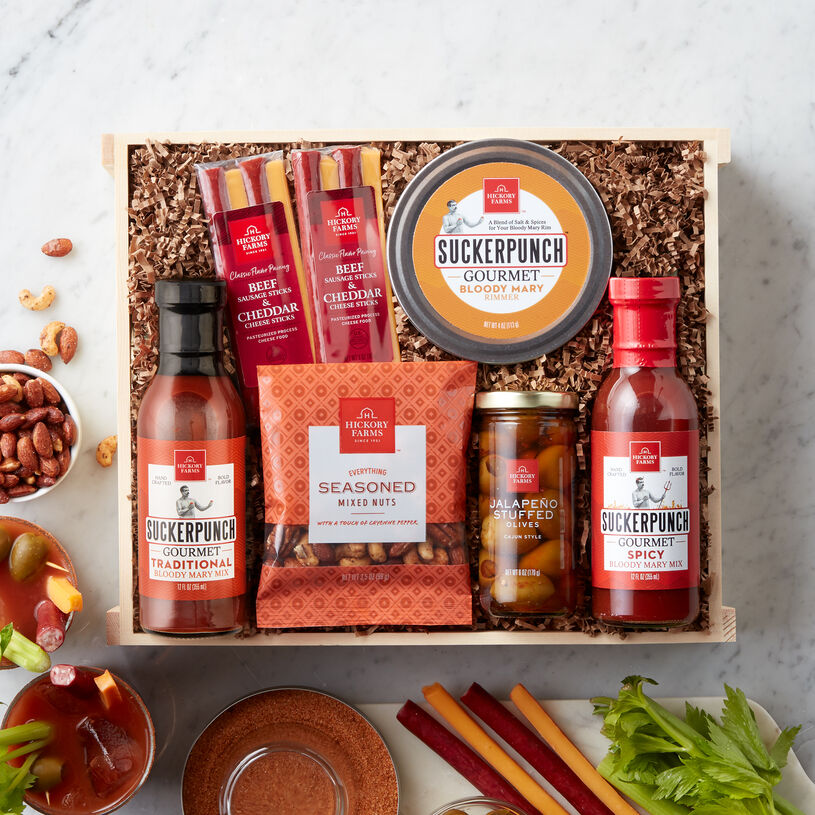 This crate features a mix for a Traditional or Spicy Bloody Mary, and salt for the rim of the glass. Serve alongside the meat & cheese sticks, Cajun Jalapeño Olives, and seasoned mixed nuts.