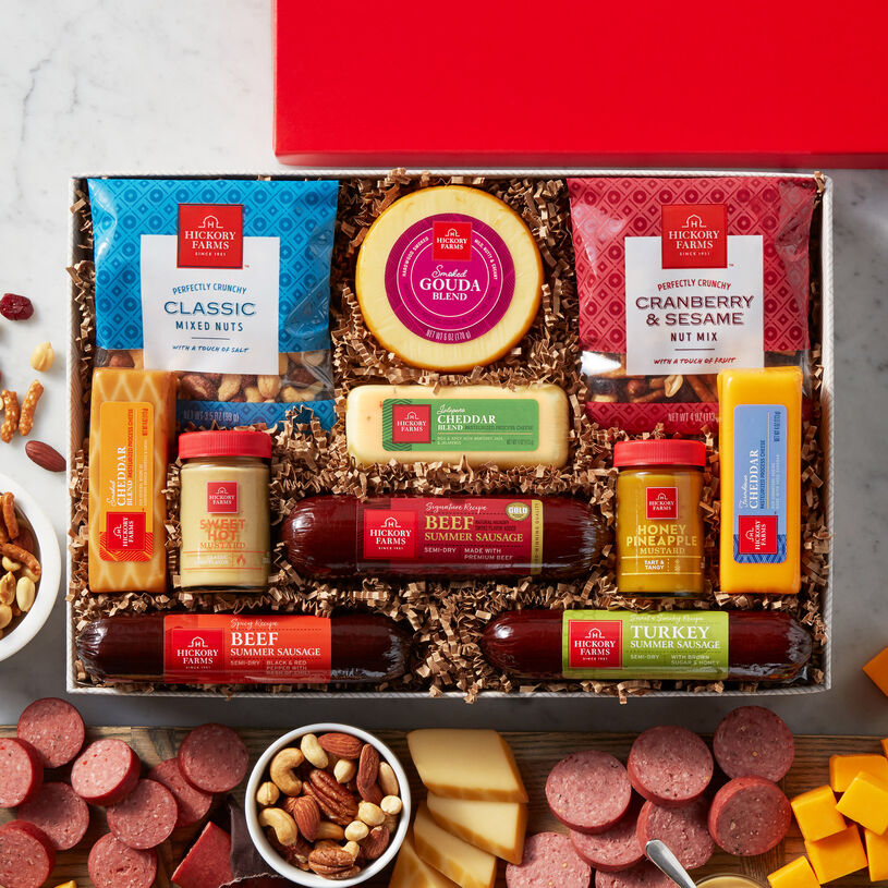 The Give Back Gift Box includes various sausage, cheeses, and nuts