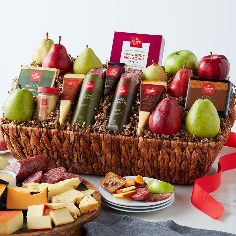 The Savory Harvest Gift Basket includes pears, apples, cheese, salami, and crisps.