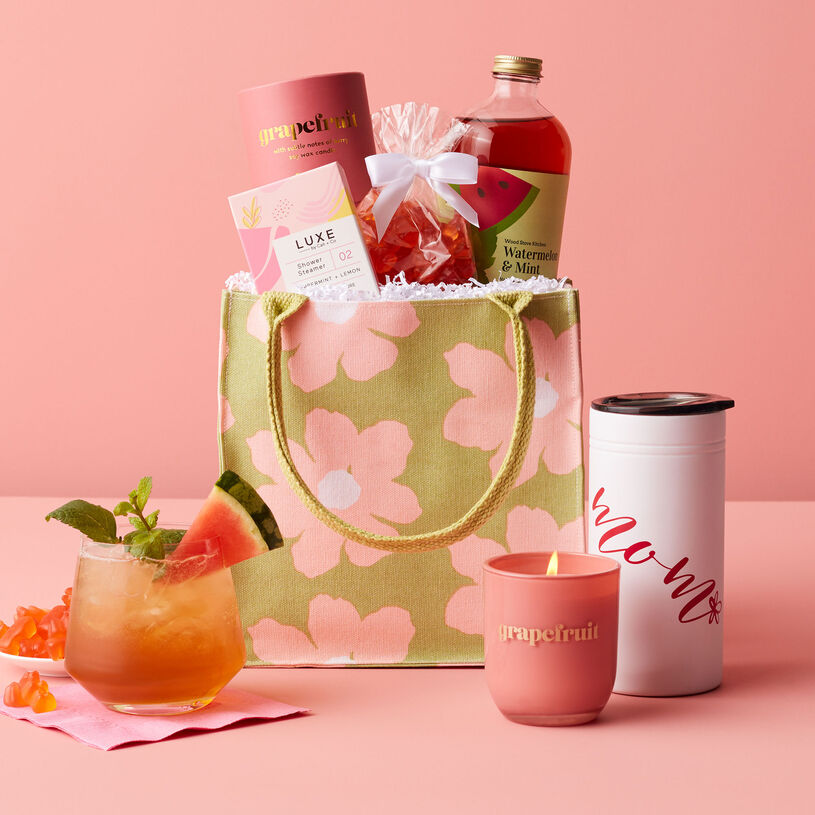 This Mother's Day is full of pampering treats like Watermelon & Mint Cocktail Mix, Mom Tumbler, Champagne Gummies, Peppermint + Lemon Shower Steamer, Grapefruit Candle, and a resuable floral tote.