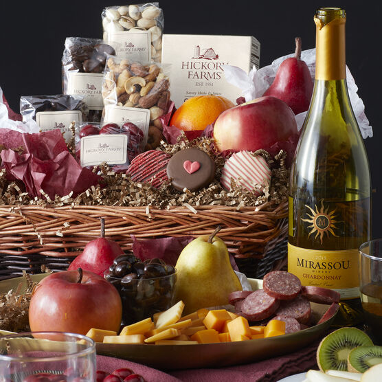 Valentine's Day basket includes summer sausage, fruit, cheese, nuts, and sweets