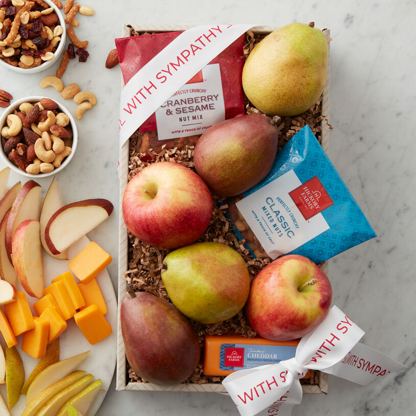 This fruit gift offers a handpicked variety of Hickory Farms' freshest favorites. Included are Crown Comice Pears, an assortment apples, smooth and creamy Farmhouse Cheddar, Cranberry & Sesame Nut Mix, and Classic Nut Mix.