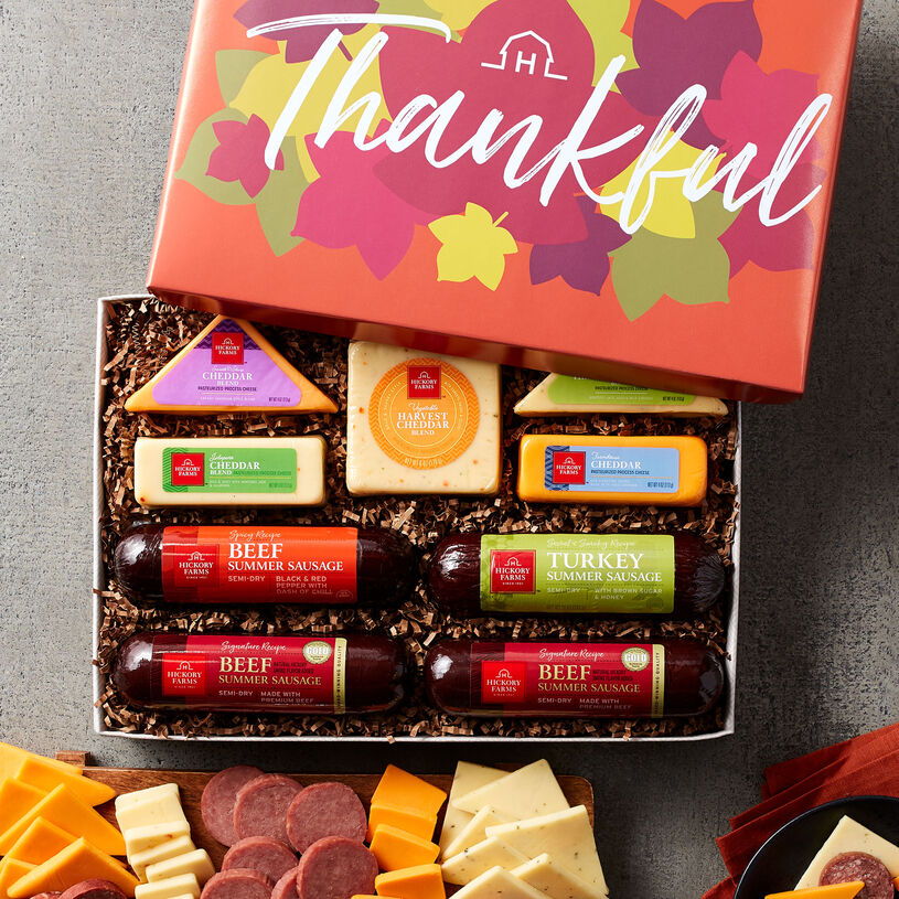 This fall meat and cheese gift features Signature Summer Sausages, Harvest Cheddar Blend, Farmhouse Cheddar, Jalapeño Cheddar Blend, Three Cheese & Onion Blend, and Smooth & Sharp Cheddar Blend.