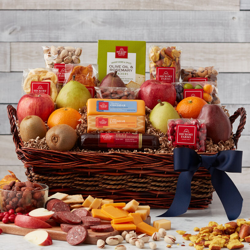 This Father’s Day basket includes fruits, nuts, meats, cheese, crackers, and a cookie.