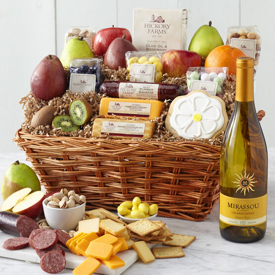 Spring Gift Basket includes sausage, cheese, a variety of fruit, nuts, mints, Mirassou Chardonnay and a flower cookie
