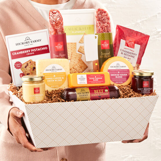 Hickory Farms Deluxe Charcuterie Gift Basket held in hands