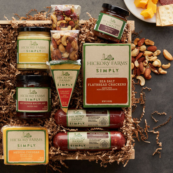 simply deluxe gift crate includes various sausages, cheeses, nuts, crackers, and spreads