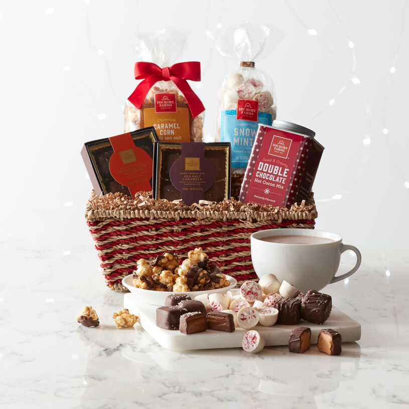 This basket is packed with decadent chocolates like Peanut Butter Meltaways and Dark Chocolate Caramels, Peanut Brittle Popcorn, Peppermint Snow Mints, and our rich hot cocoa mix.