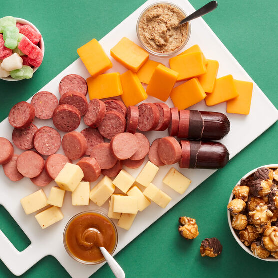 Holiday Sweet and Savory Gift Tower meat and cheese sliced and arranged on board